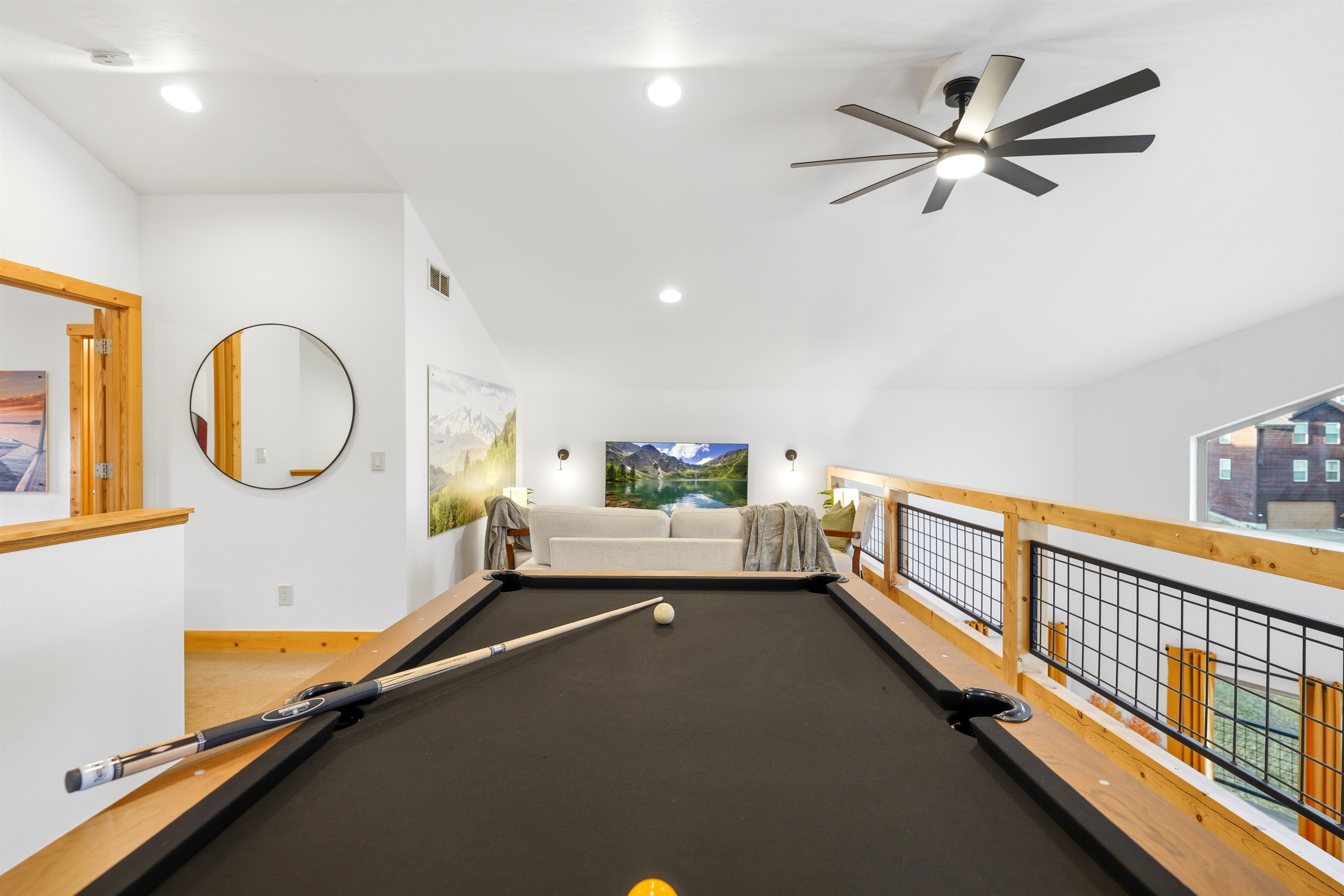 Gather for a friendly game, cheer each other on, and let the laughter drift down into the living room below.