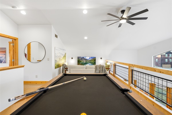 Gather for a friendly game, cheer each other on, and let the laughter drift down into the living room below.