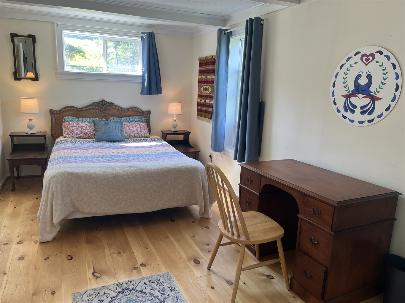Queen bedroom off living room with desk
