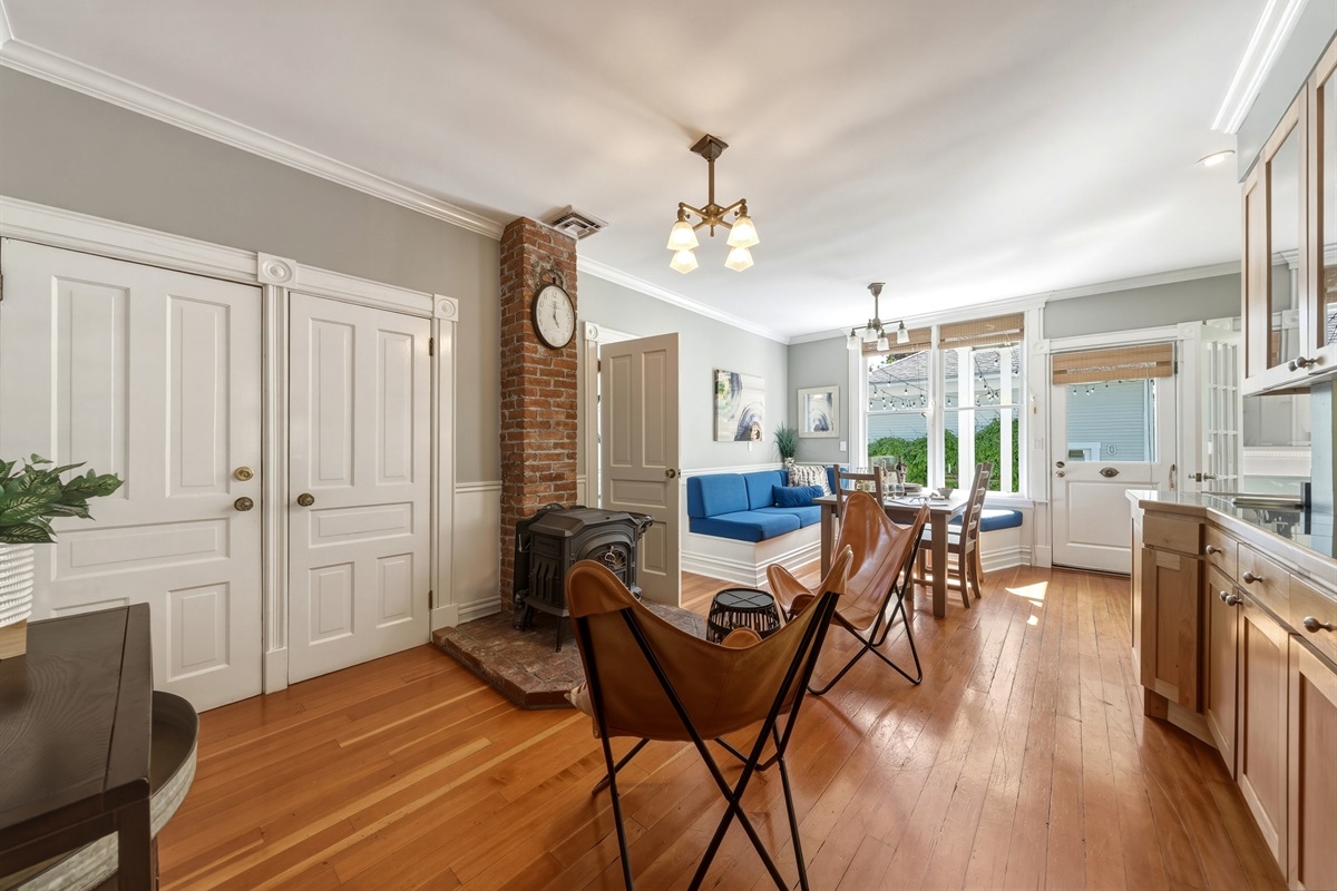 Lounge seating with wood stove (firewood provided), adjacent to the kitchen and breakfast nook