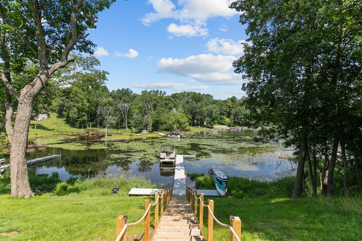 The pier stretches out over the sparkling lake, offering beautiful views and peaceful moments by the water.