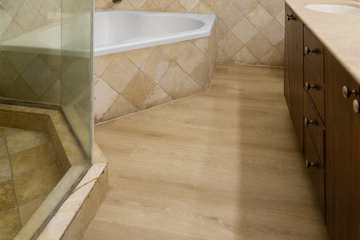 Primary Suite en-suite with separate tub and walk-in shower, double-sink vanity