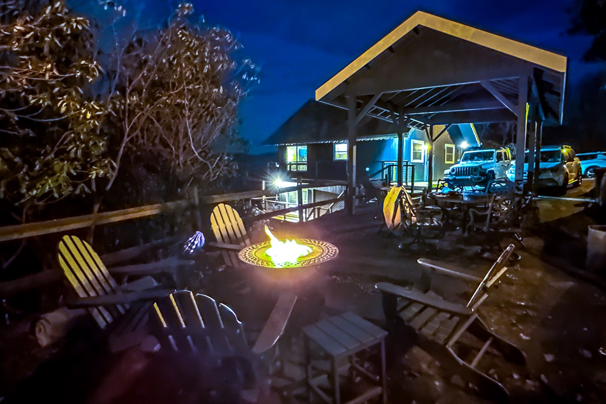 The propane fire pit table has 4 New Polywood Adirondack chairs w/ side tables, & is next to our covered patio area w/ 6 more chairs & dining table. Available when no burn ban in place.