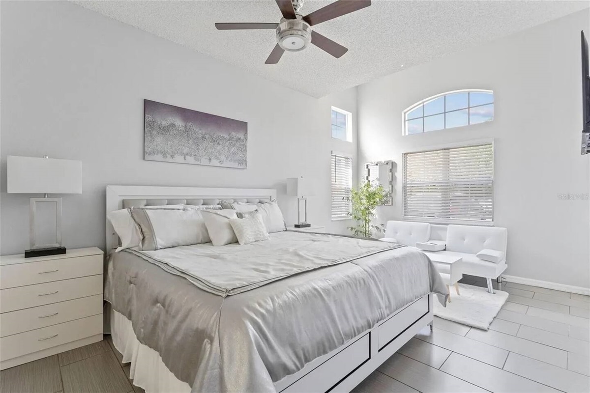 This is the King Bedroom on first floor, special for those who do not like stairs. This lovely bright bedroom has a TV, and a comfy sofa.
