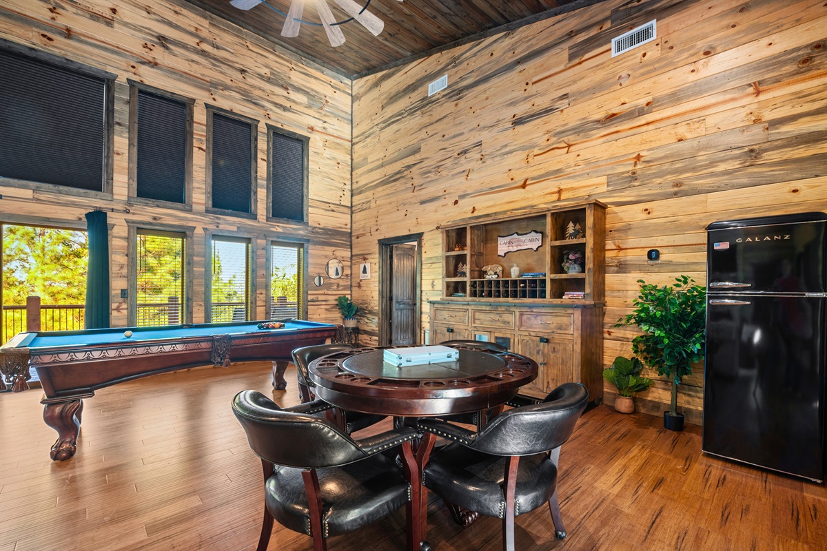 A comfortable lounge area in the loft offers plenty of seating and a relaxed, cozy vibe.