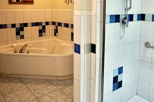 Relaxing Retreat: Indulge in the spa-like tub and modern shower for ultimate relaxation!
