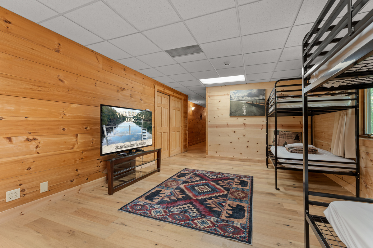 Bunk area with 60 inch smart TV.