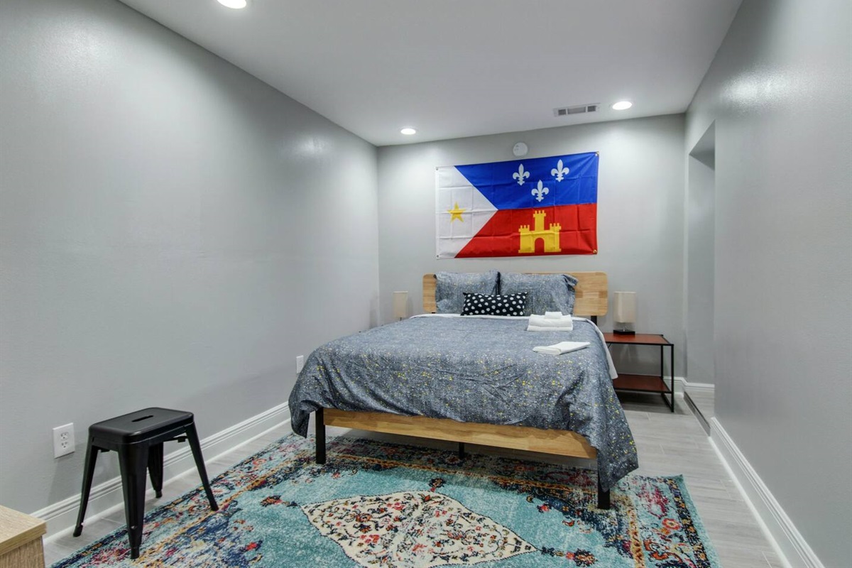 Bedroom 3. Queen bed.  Exterior door.  (Not pictured: Roku TV.)