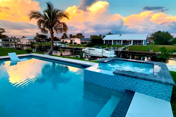 Sunset reflections over the pool and spa