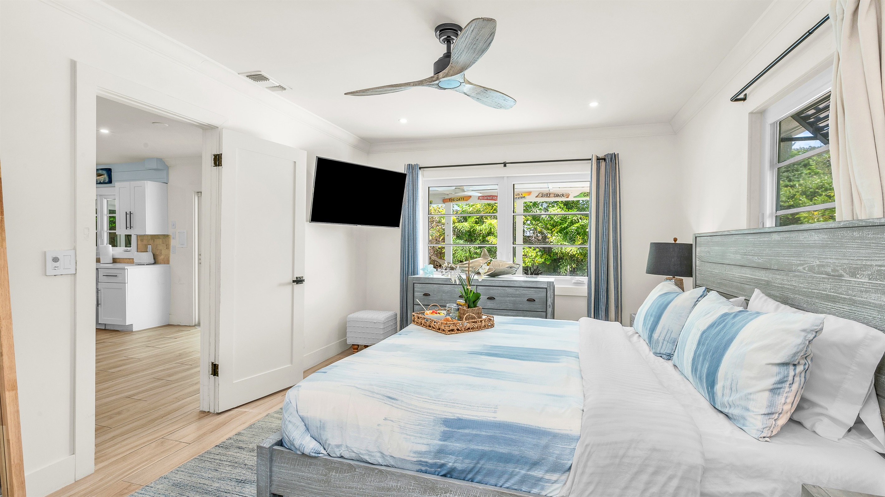 Primary Suite: King-size Tempur-Pedic Pro Adapt mattress, en-suite bath with dual-sink vanity. Pool views. 