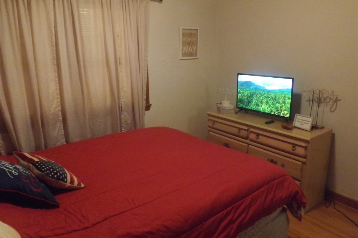 Queen bed with Roku Smart TV
