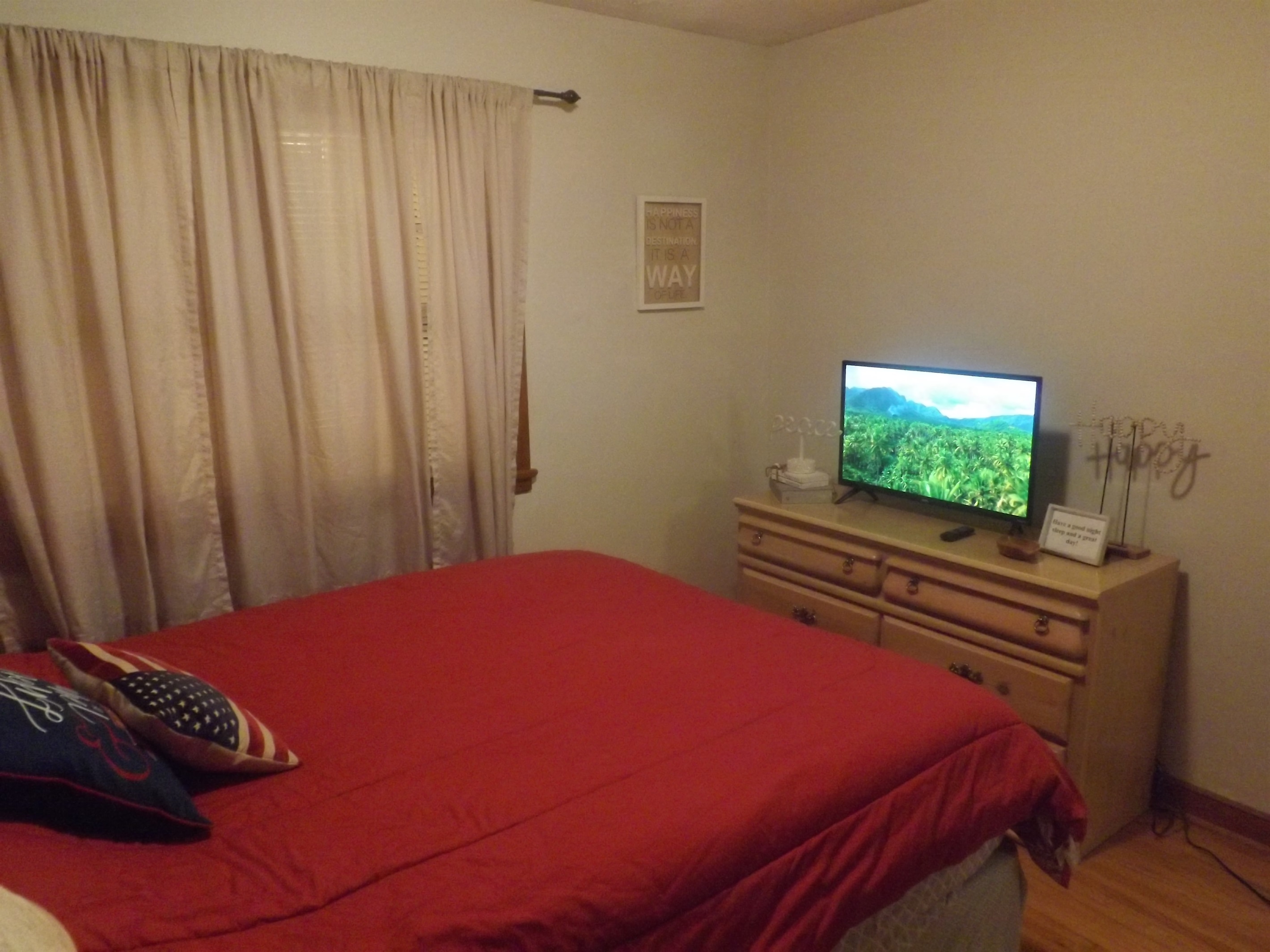 Queen bed with Roku Smart TV