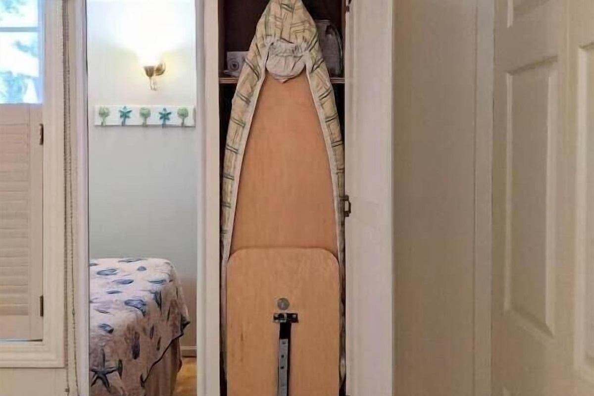 queen bedroom with built in ironing board