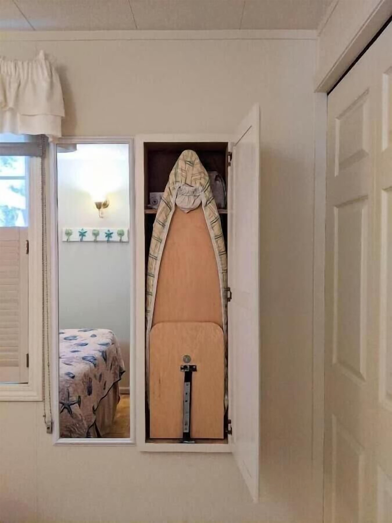 queen bedroom with built in ironing board