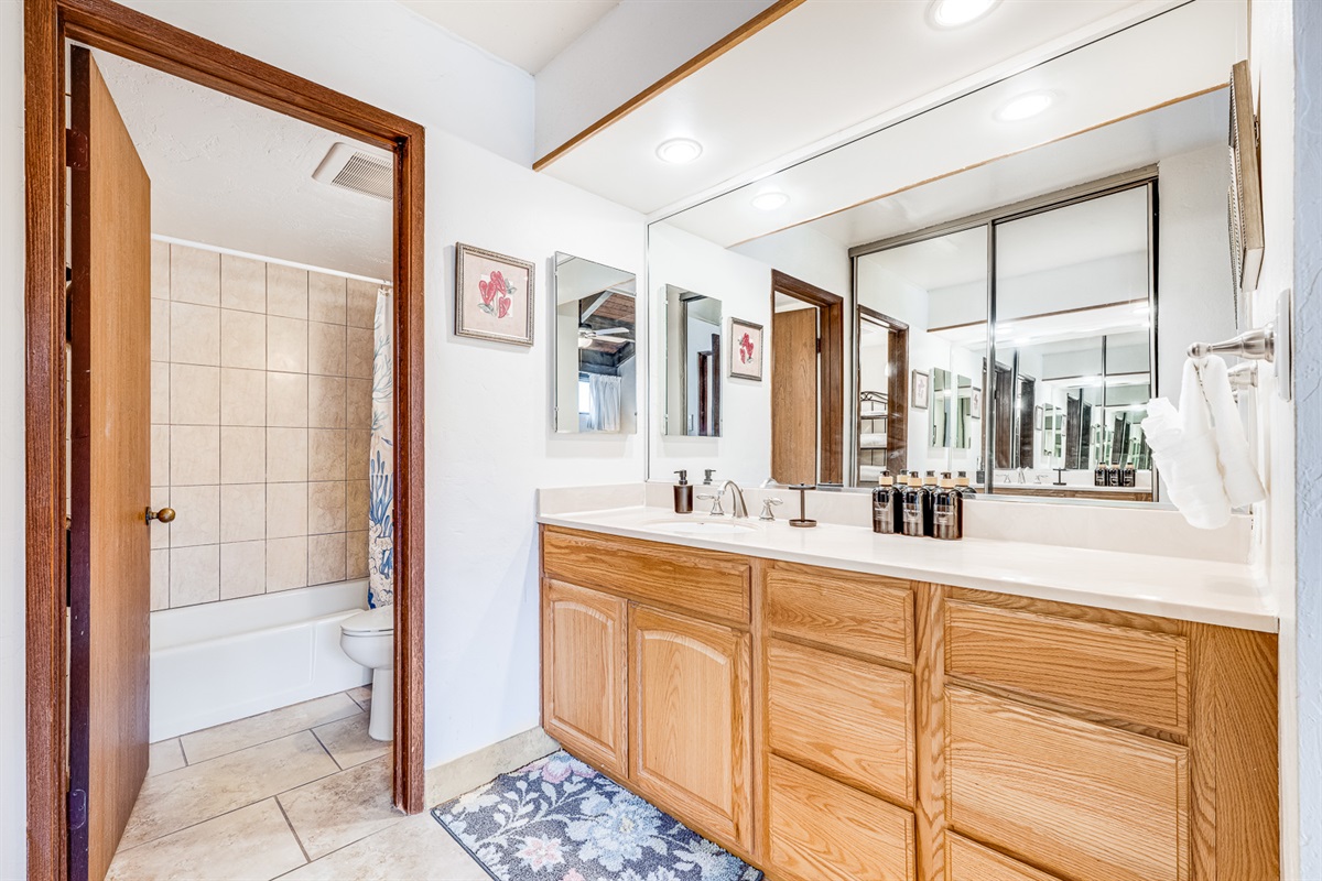 Spacious primary bath with full tub and shower
