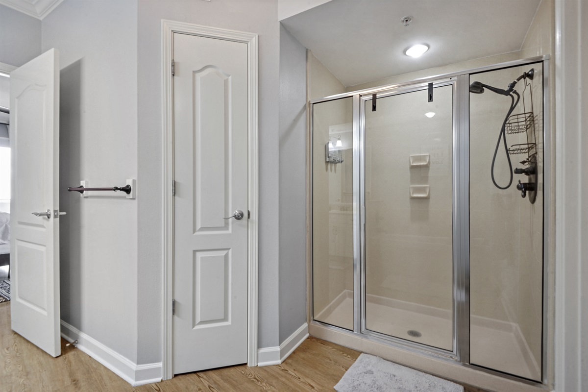 master en-suite bathroom: shower, linen closet