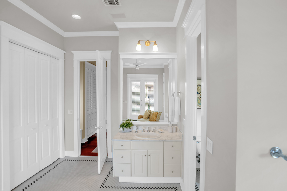 2nd floor king bedroom ensuite bathroom with double vanity, tub and shower.