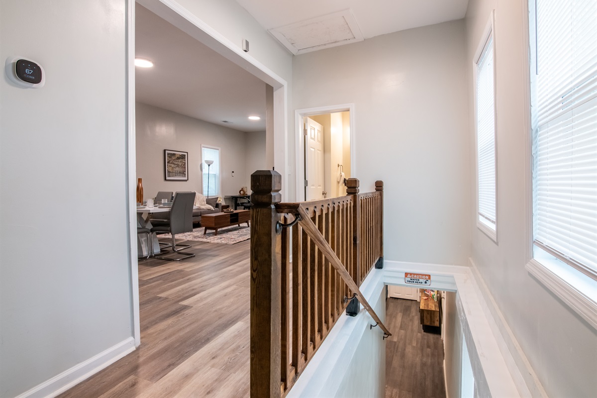 A welcoming hallway accented with warm, modern décor.