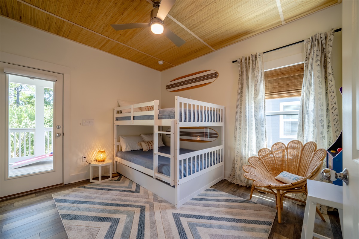 Full over Full bunk bed with a twin trundle, and access to the second floor deck