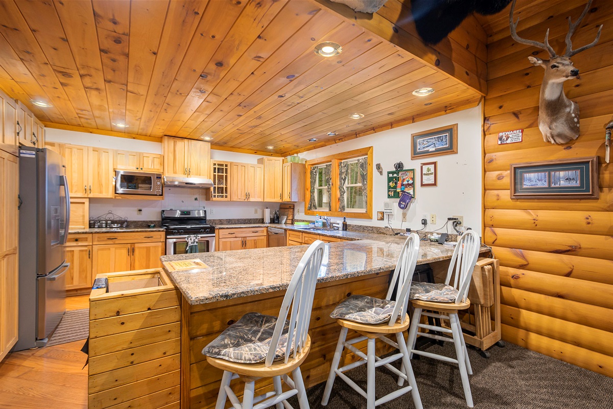 Kitchen with high top bar stools