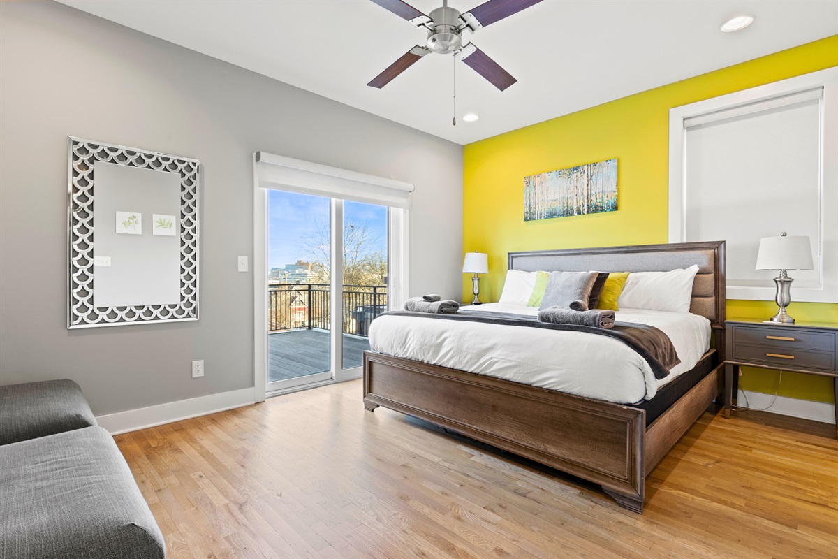 The master Bedroom at Casa Tiffani features a luxurious King Size bed, private balcony, with pops of color in all the right places.