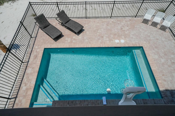 The middle floor deck is directly above the pool which can be conveniently accessed from the exterior staircase.