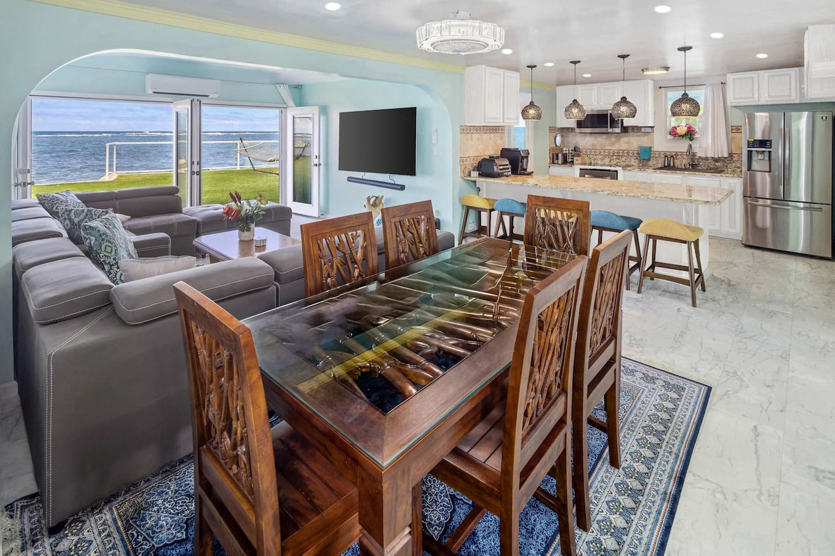 Two L-shaped recliner sleeper sofas, Bamboo Dining Table, Wolf Appliances, Gourmet Kitchen and 90-inch 8K Samsung TV Home Theater Room with 11-1 channel surround system