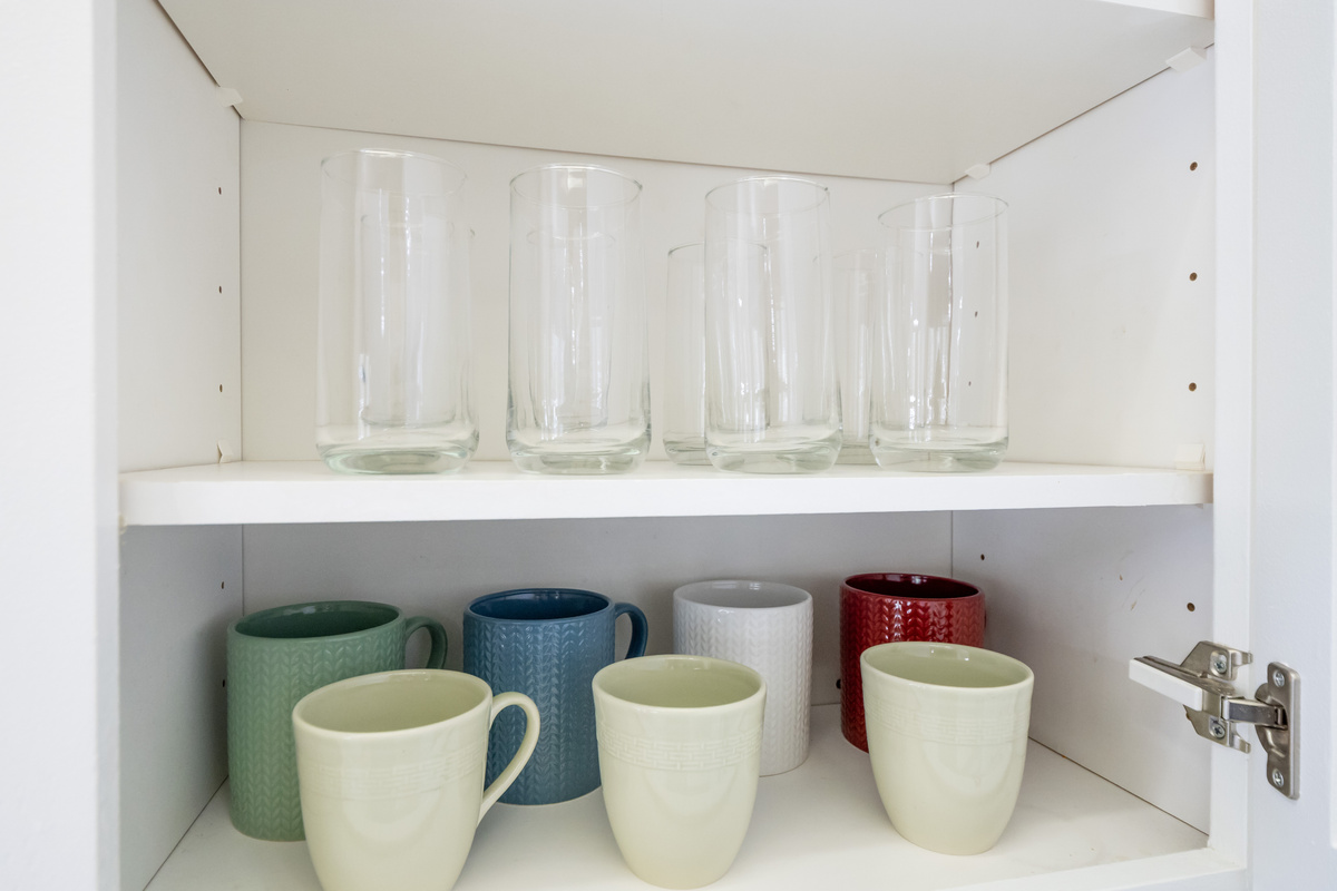 Enjoy your favorite beverages with a selection of drinking glasses and coffee mugs, conveniently stocked and ready for your stay.