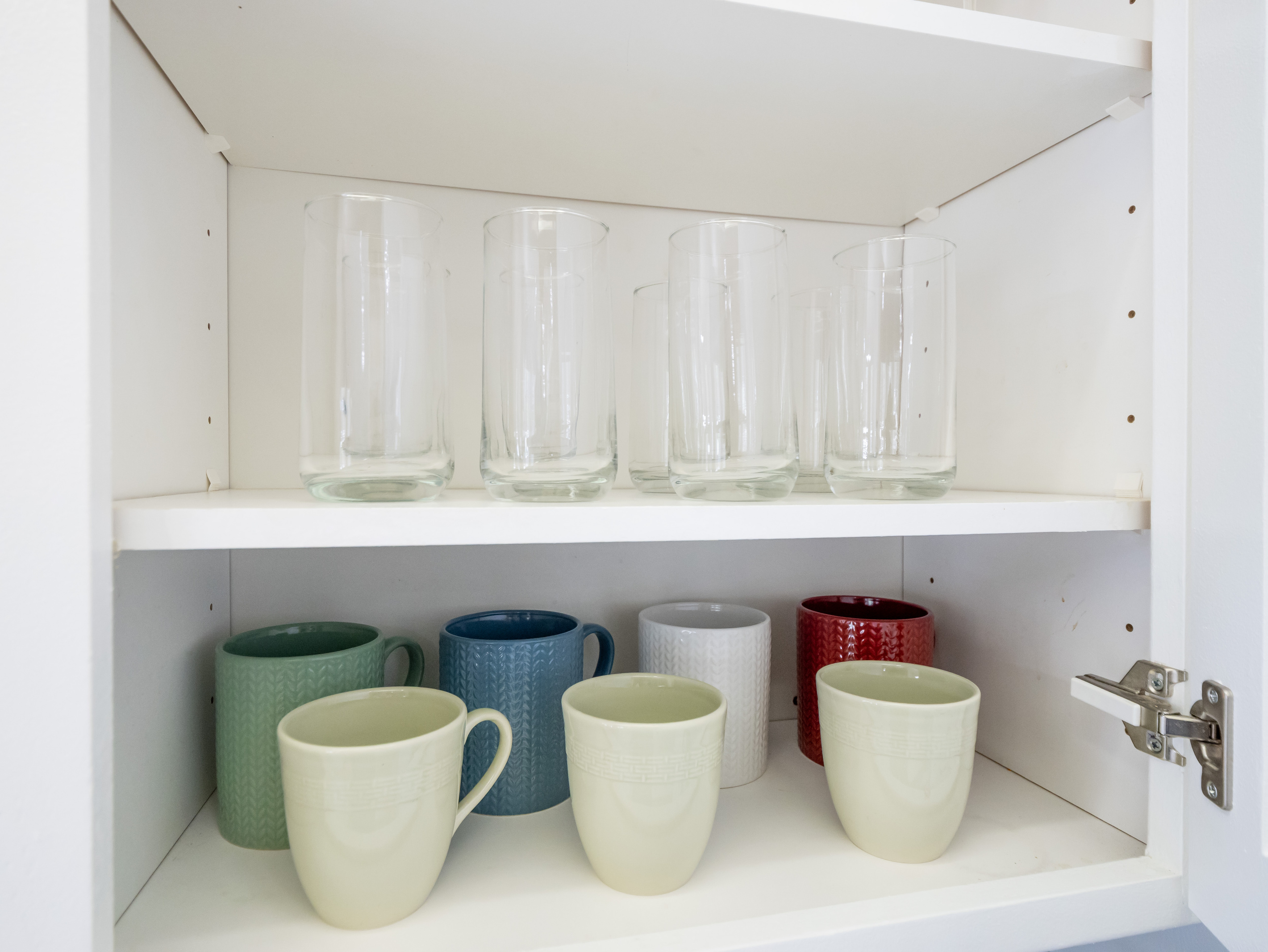 Enjoy your favorite beverages with a selection of drinking glasses and coffee mugs, conveniently stocked and ready for your stay.