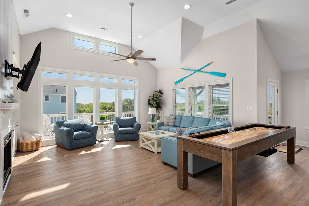 Enjoy ample lounging space plus a fun game table for evenings in together.