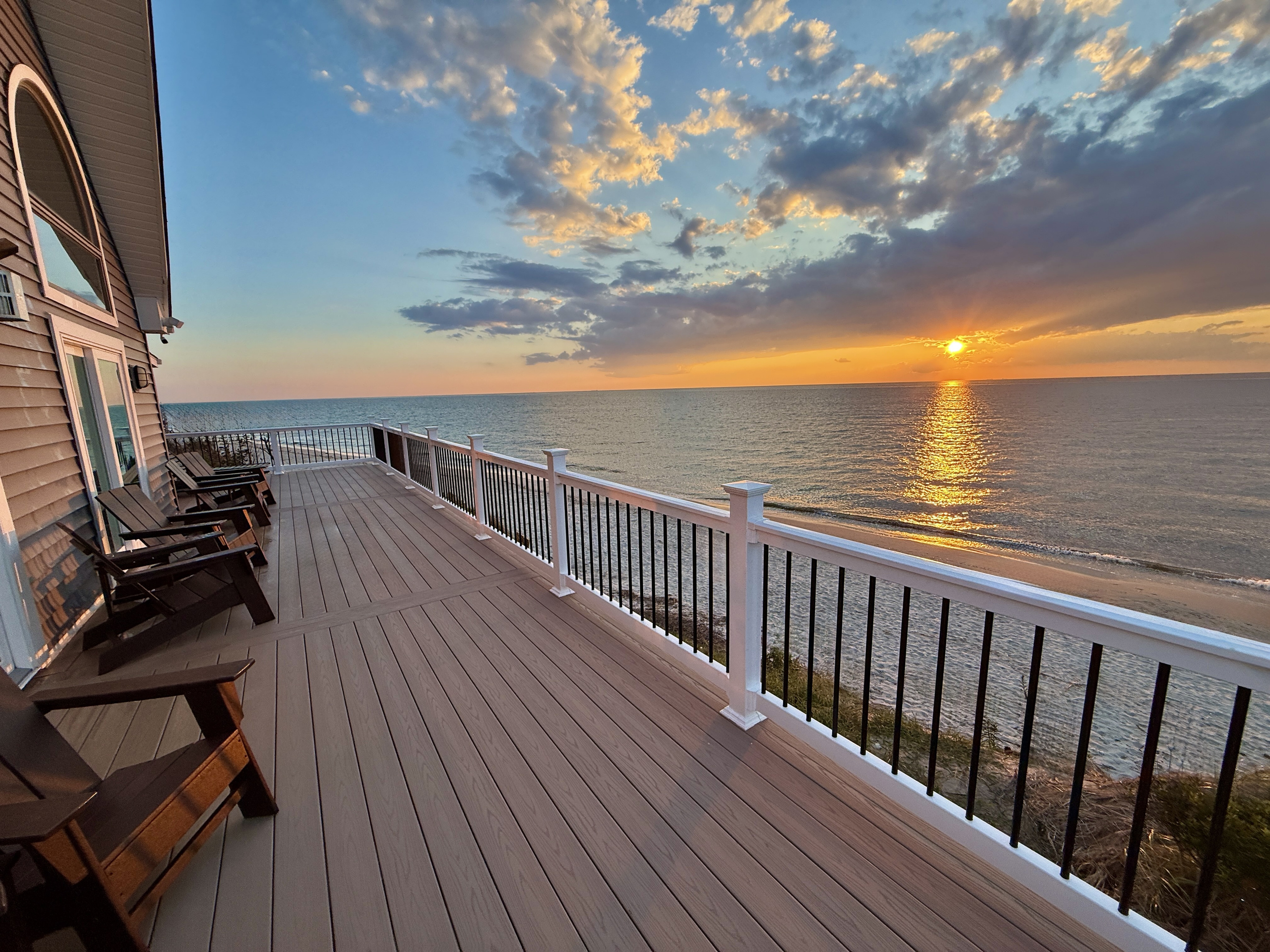Unwind on the expansive private deck, which provides an ideal setting to enjoy a beautiful sunset over the ocean. The deck is equipped with comfortable lounge chairs, making it a perfect spot for relaxation.