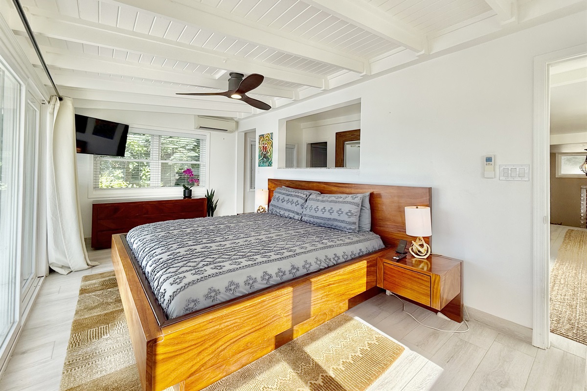 The primary bedroom features a king bed and a spacious balcony. You're just two clicks away from the views off of that balcony.