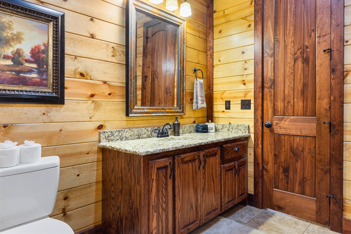 Granite countertop and rustic wood finishes.