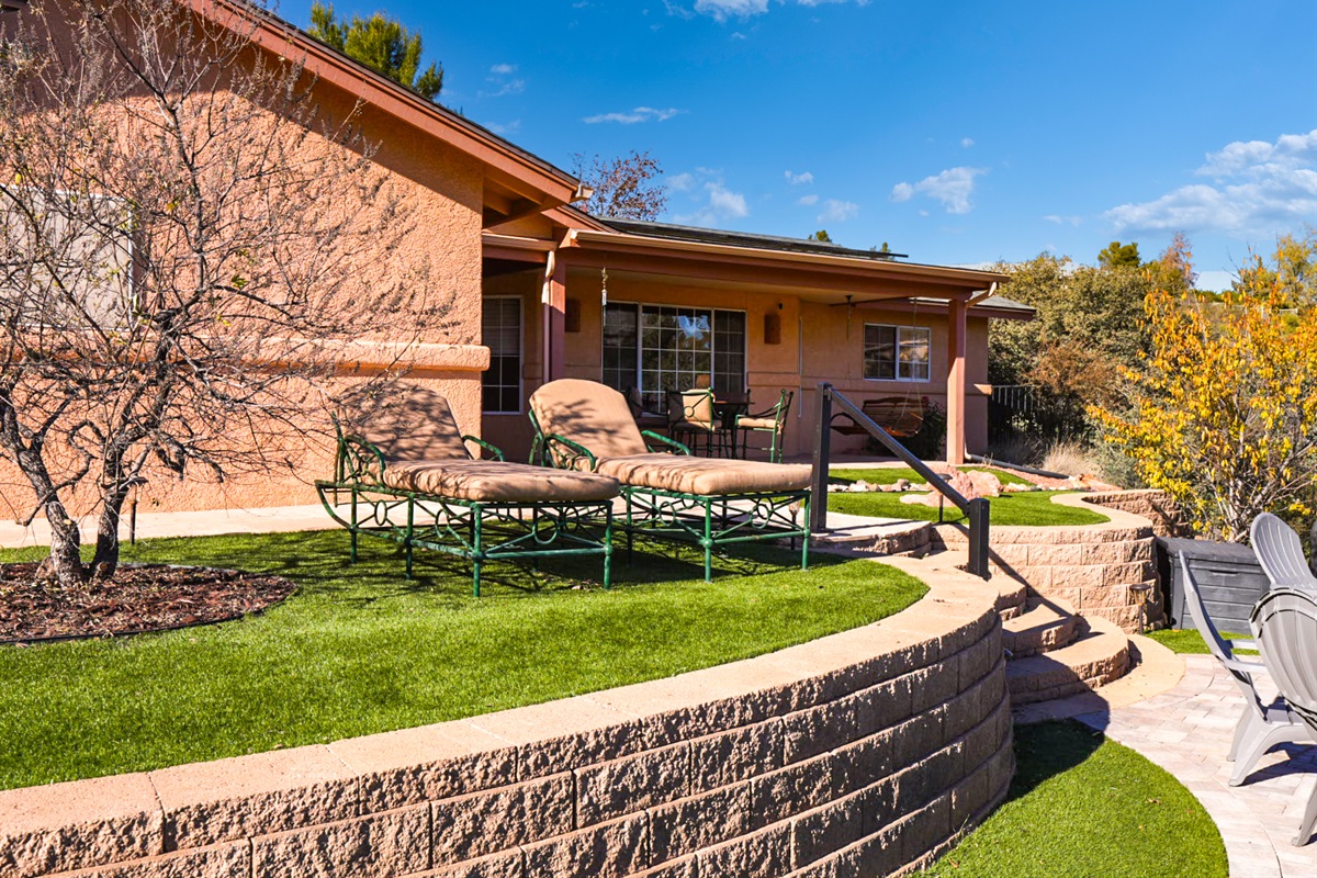 Relax on the elevated lawn with cushioned loungers—perfect for sunbathing, reading, or enjoying peaceful views.