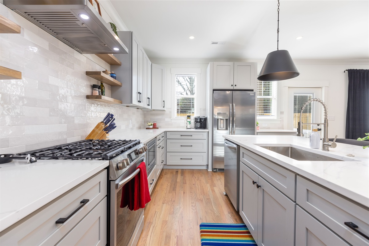 The large kitchen has stainless steel appliances and quartz countertops. Plenty of space for the whole group!