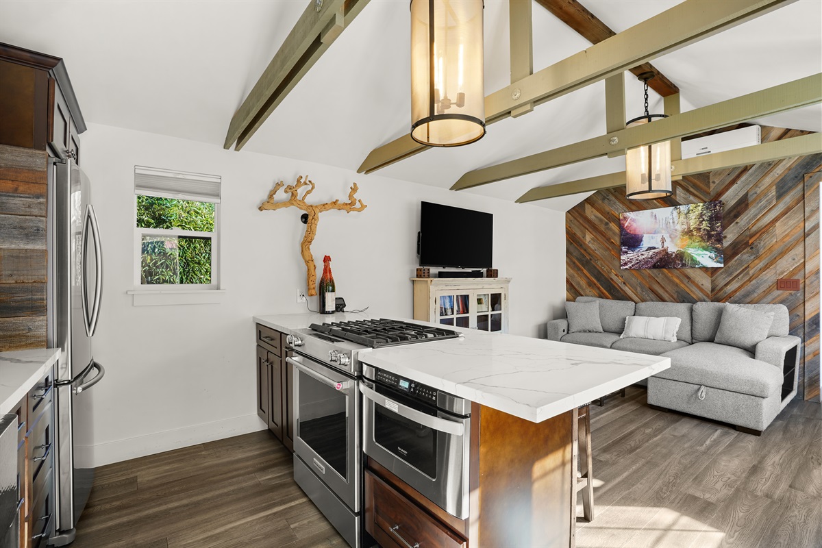 Fully stocked kitchen, smart tv and living room with sleeper couch