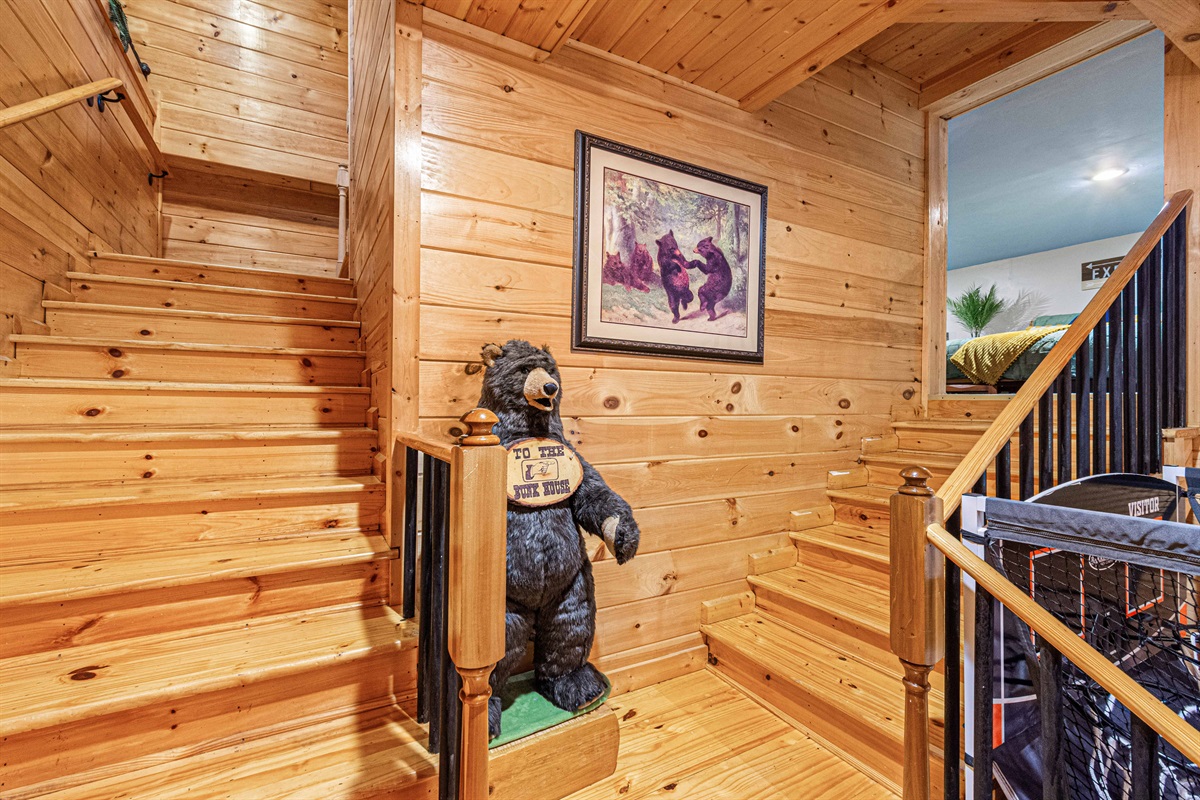 Cozy retreat upstairs. Access comfortable bedrooms via this inviting wooden staircase.