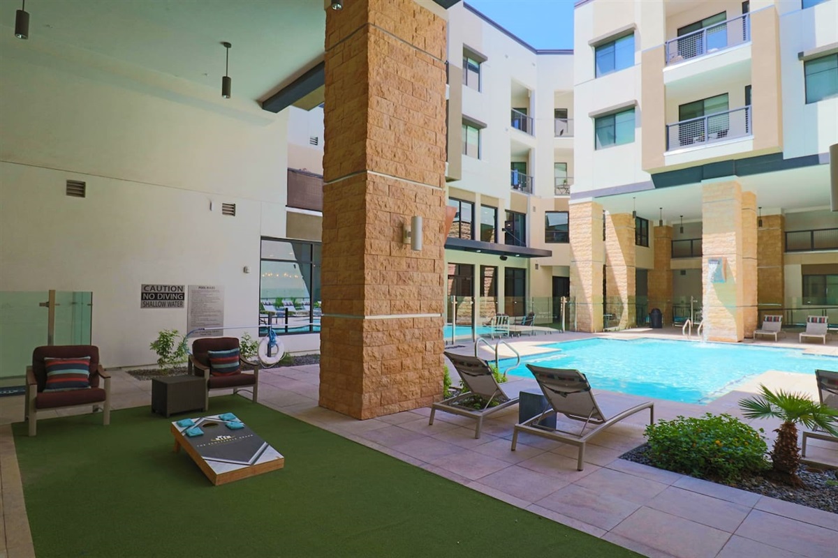- Lounge by the covered poolside area designed for comfort and laid-back fun   - Enjoy outdoor seating and a relaxing view of the sparkling pool waters   - Ideal for reading, chatting, or a casual game under shaded comfort