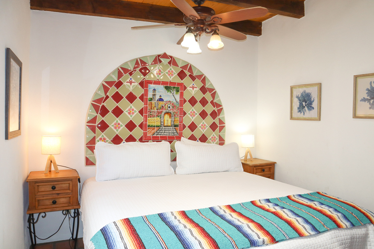 Quiet Suite, King-size bed, Luxury linens, Ceiling fan, Dedicated bathroom with tub/shower.