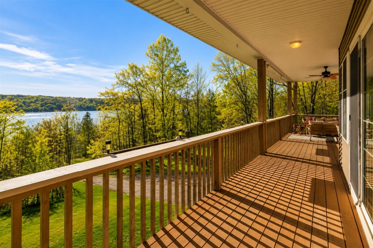 Soak in the panoramic views from this expansive deck, a perfect spot for relaxation or entertaining with a stunning backdrop. 