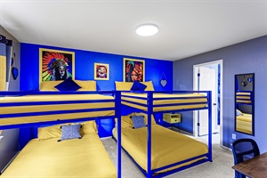 Fun and playful bunk bed room with colorful decor, perfect for kids and sleepovers.