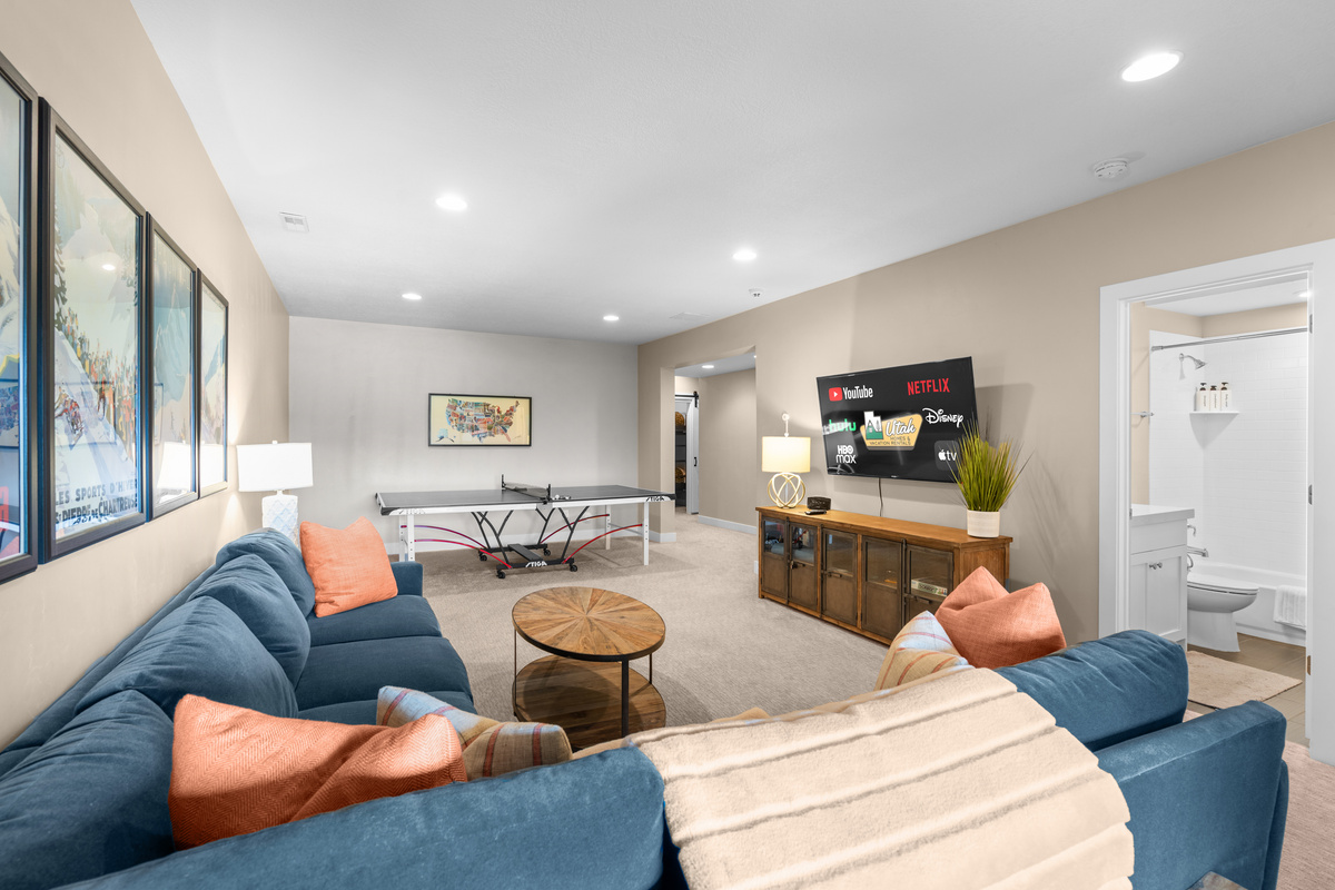 Large family room with a ping pong table and entertainment space.
