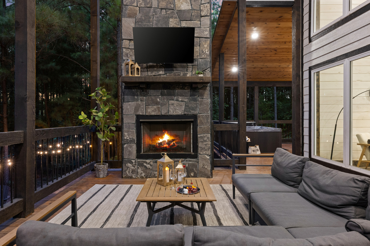 This is where evenings slow down. Cozy up by the outdoor fireplace, turn on the TV, and let the quiet woods be your backdrop.