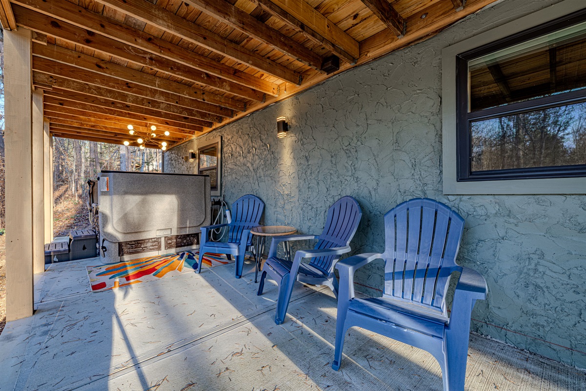 Step outside to your private mountain oasis. This covered patio offers a secluded spot to breathe in the fresh air while enjoying the surrounding forest views.