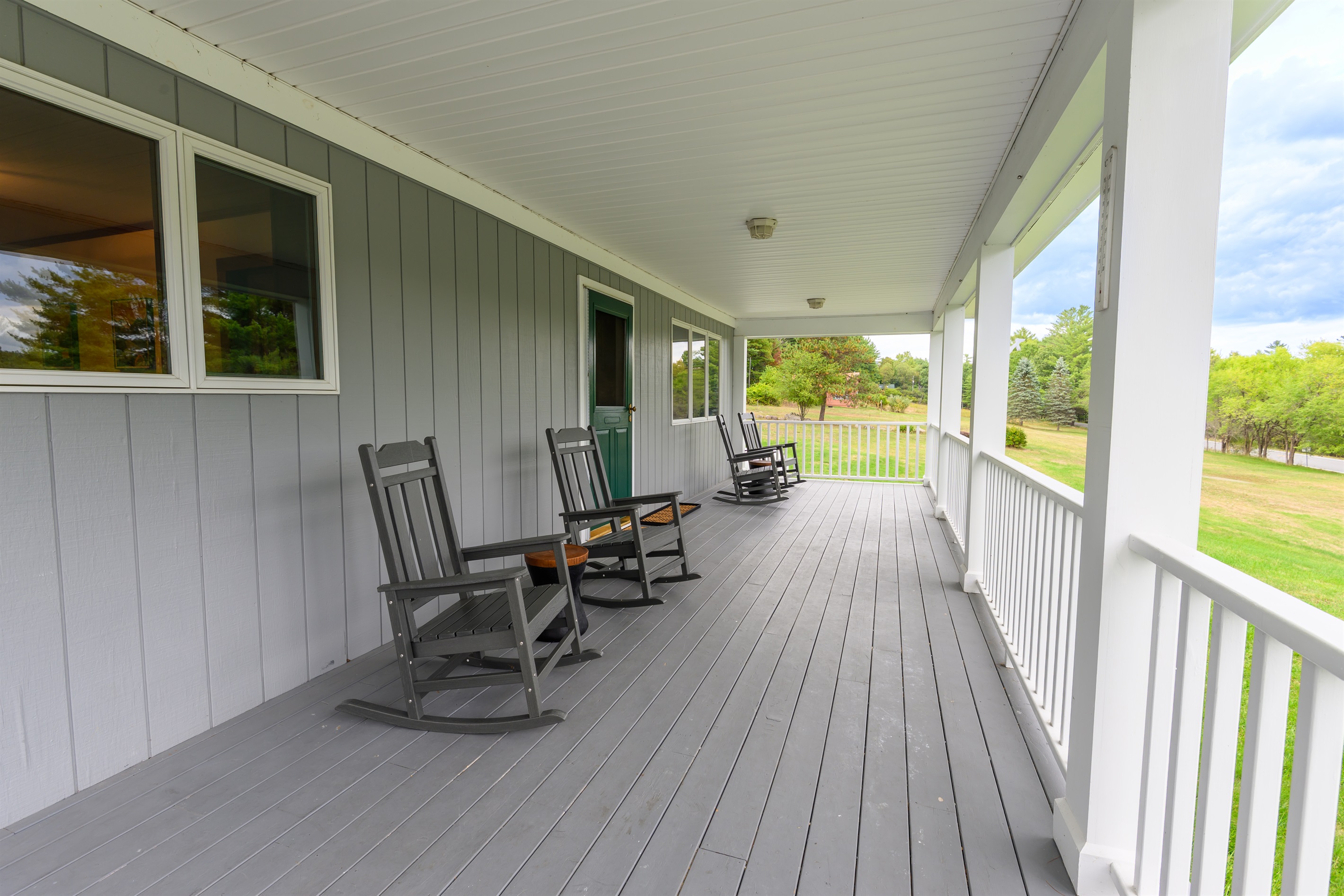 4 Rocking chairs on the covered porch perfect for relaxation