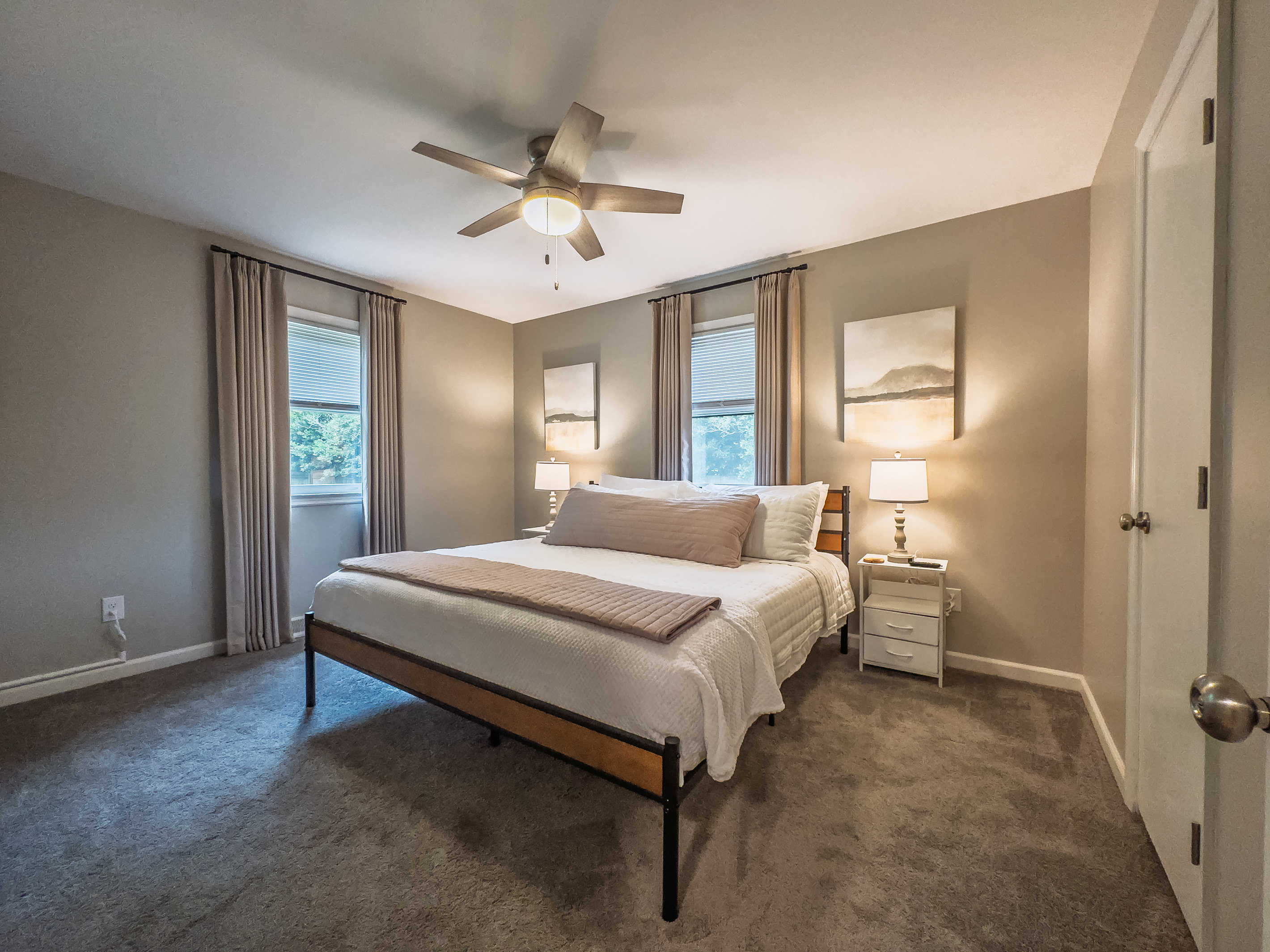 King bed, 55" Smart TV, ceiling fan, two led light nightstands with multiple charging ports, two multi light function lamps, blackout curtains, dual closets.