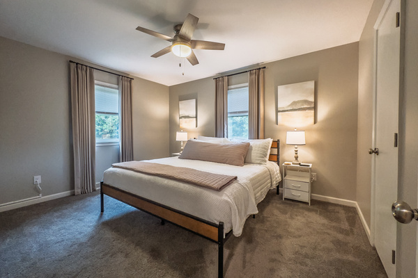 King bed, 55" Smart TV, ceiling fan, two led light nightstands with multiple charging ports, two multi light function lamps, blackout curtains, dual closets.