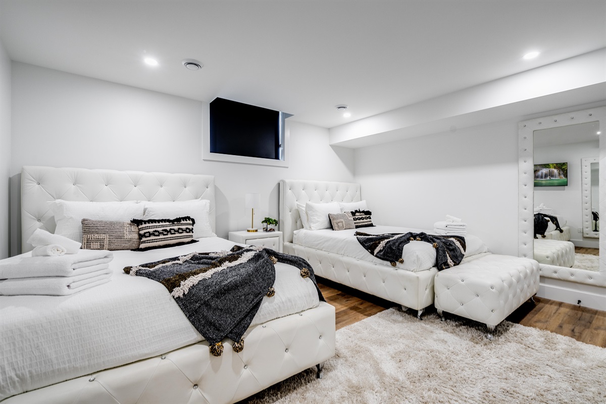  Lower level bedroom with two queen beds.