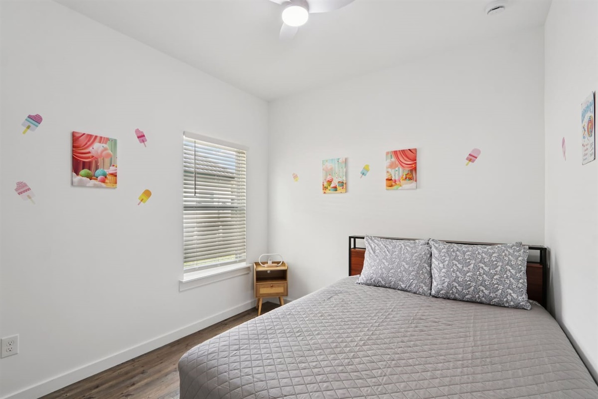 Bedroom has Queen Bed, twin trundle under bed, nightstand, suitcase holder, closet with hangers