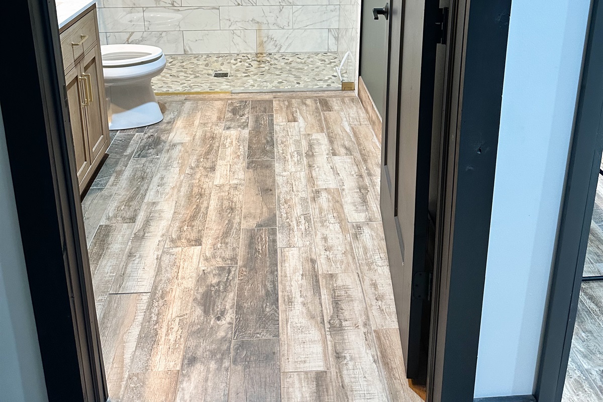 Our main bathroom features a doorway wider than 32 inches and a roll in shower for accessibility. 